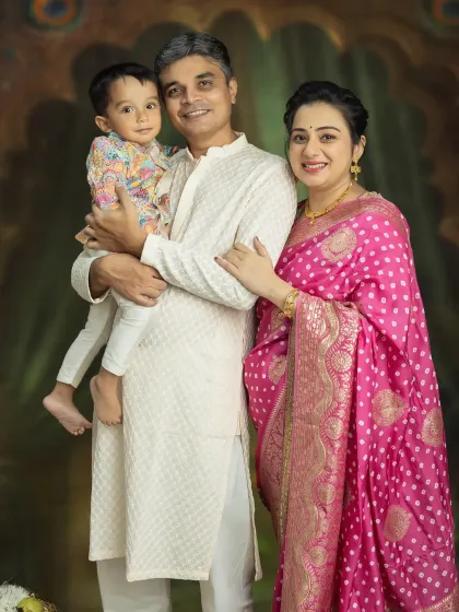 A beautiful family portrait, celebrating the journey to becoming a family of four. Capturing the bond between parents and their first child before the new baby arrives is always a special moment.