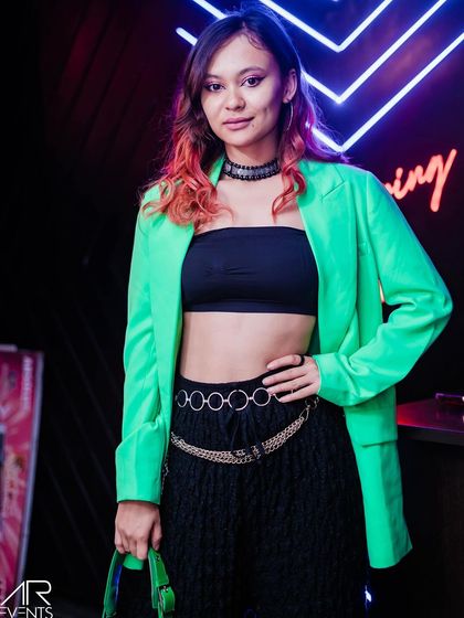 A guest posing in a neon green jacket.