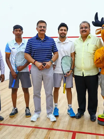 Posing with officials and the tournament mascot after a successful event in Kanpur.