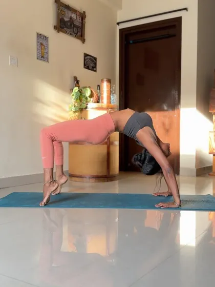 Another shot of Wheel Pose, this time with a focus on the arch of the spine and the opening of the shoulders.