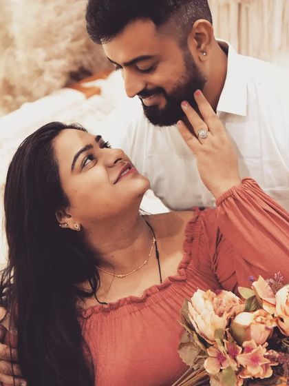 This close-up shot captures the loving gaze between the parents-to-be. The warm, vintage-style color grading adds to the romantic and nostalgic feel of the portrait.