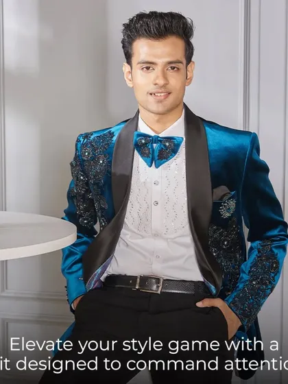 Elevate your style game with a suit designed to be a statement. A close-up of the blue velvet tuxedo shows the intricate details and the confidence it inspires.