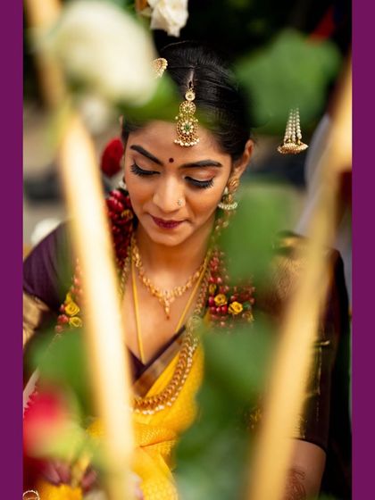 Another beautiful moment from Nithyashri's wedding. This close-up shows the soft, blended eyeshadow and the subtle glow on her skin, which is central to my makeup style.