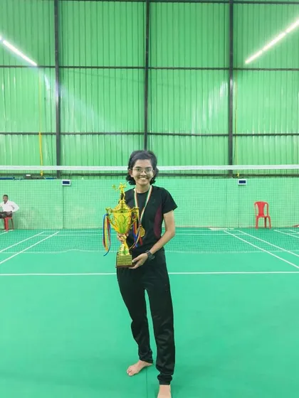 Our player celebrating her team's win at the Inter-Collegiate Badminton Tournament (Mumbai University), representing Birla College.