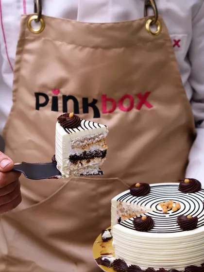 Here’s a look at what’s inside. We believe a cake should taste even better than it looks, which is why we bake everything fresh using quality ingredients. This slice shows the fluffy, multi-layered texture you can expect in every order.