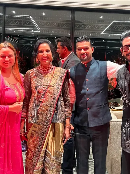 Posing with the lovely hosts and guests at the Jhunjhunwala Diwali party. Every guest is important, and I make sure to connect with everyone.