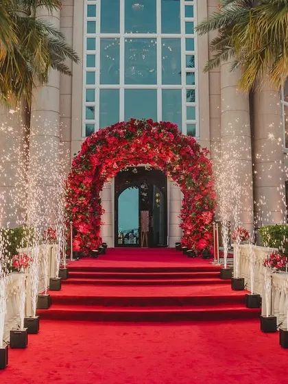 The grand entrance to a wedding in Doha, with a red carpet and cold pyro fireworks creating a spectacular welcome for the couple and their guests.