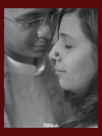 A close-up, black and white portrait of the couple. The intimacy and soft focus create a timeless and emotional feel.