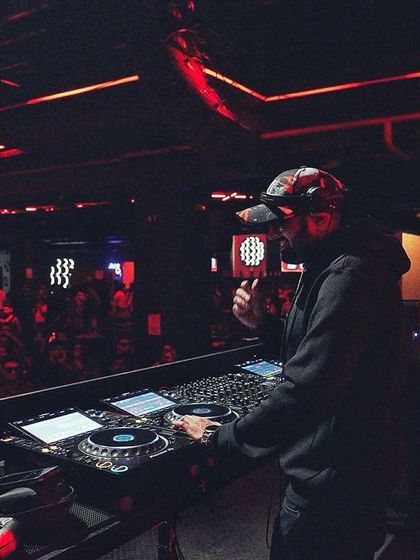 Same moment, different vibe. The focus is intense when you're blending tracks for a festival crowd.