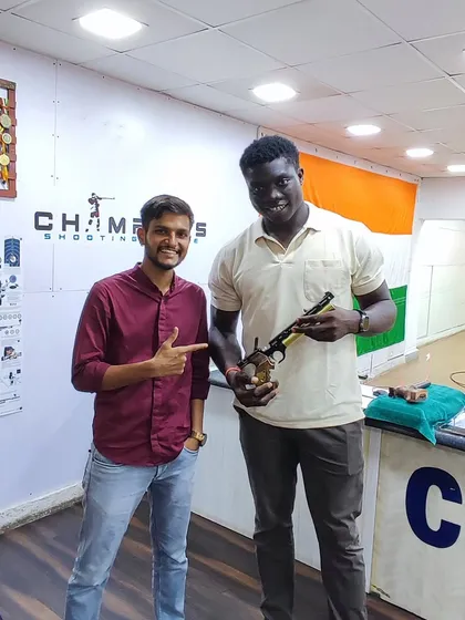 Another great shot of @istanboss checking out an air pistol at our Andheri range. We love introducing new people to the sport of shooting.