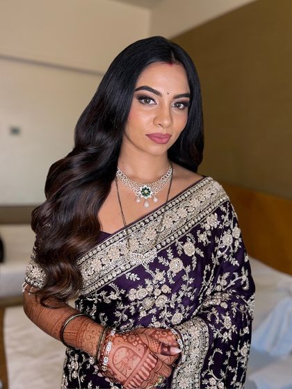 Another beautiful shot of this timeless look. The makeup is designed to look flawless from every angle, ensuring she feels confident throughout the event.