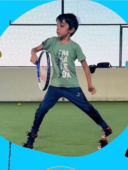 This young athlete is mastering the game one swing at a time. I believe every child has the potential for greatness, and my classes are designed to help them discover and develop their unique talents in a supportive setting.