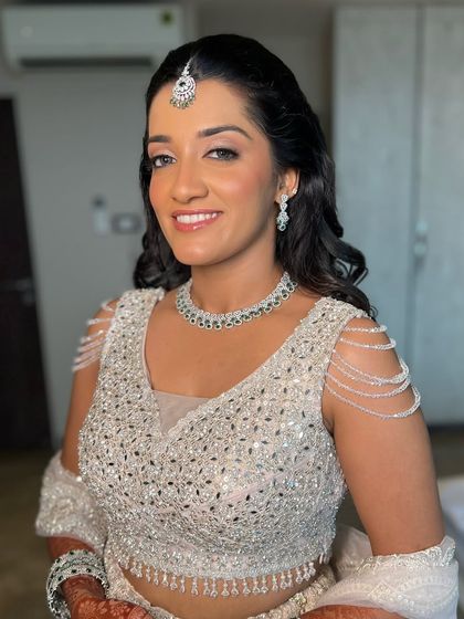 A smiling portrait of my beautiful engagement bride. The soft glam makeup enhances her features without overpowering her natural beauty.