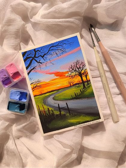 This gouache landscape painting captures a beautiful sunset over a winding country road. I love playing with the warm colors of the sky against the cool greens of the fields.