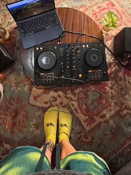 A top-down view of my living room setup for recording the 'FOR THE GIRLS' mix. Just me, my Pioneer DJ console, laptop, and some comfy socks.