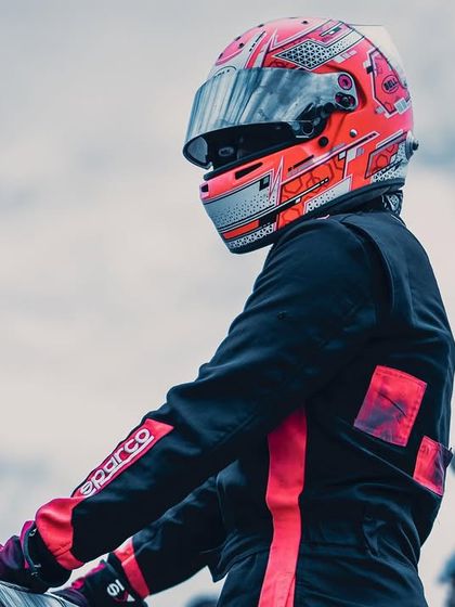 A close-up of a driver's helmet.