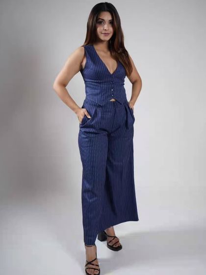 Serving She-E-O energy in this pinstripe waistcoat and pants set. It's a powerful, modern look inspired by celebrity style, available for you to rent.