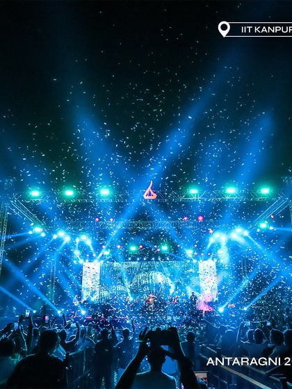 A stunning shot of the Antaragni 2023 stage, lit in blue and showered with confetti.