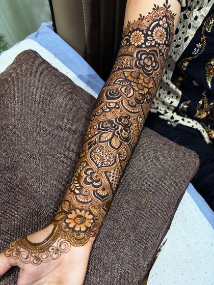 A detailed shot of the lower arm and wrist. Notice the delicate arch over the wrist, a small touch that adds so much elegance.