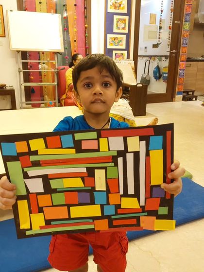Here is our toddlers' interpretation of African Kente cloth. Using simple shapes and bright colors, they created these fantastic geometric collages.