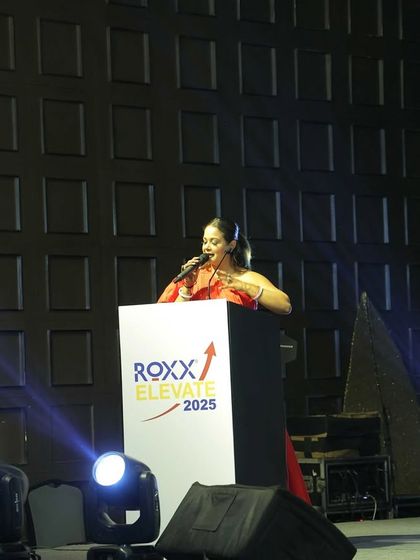 Addressing the audience from the podium at the ROXX ELEVATE 2025 conference.