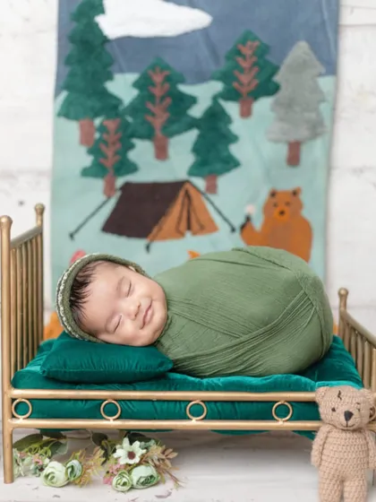That sleepy smile is just priceless! I love capturing these fleeting expressions while babies dream during their newborn session.