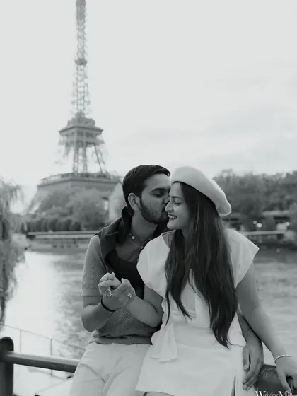 A classic black and white photo from Paris. This intimate moment with the Eiffel Tower in the background feels timeless, capturing the romance of the city and the couple's close bond.