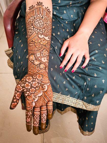 A single arm shot of a beautiful and intricate bridal design.