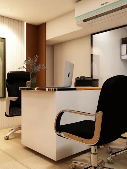 A close-up of a sleek, modern executive desk in a private office. The white lacquer finish and chrome details on the chairs create a contemporary and high-end feel.