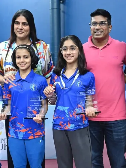 Young champions pose with their trophies alongside our management team. Celebrating the success of emerging talent is a highlight of our event management services for junior badminton.