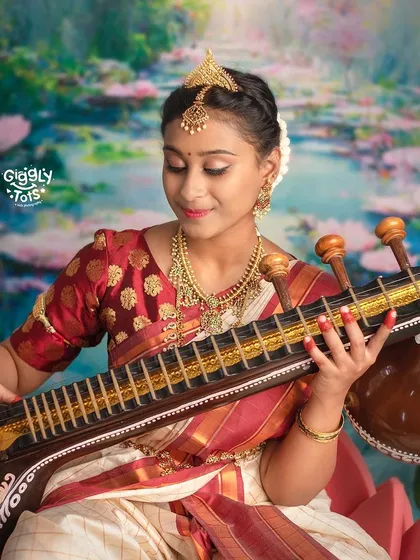 Enlightenment through art. A close-up of our little Saraswati, beautifully capturing her devotion and the elegance of the theme.