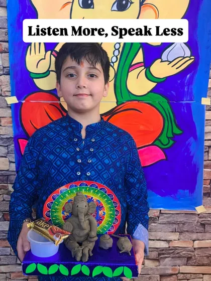 Our Ganesha workshops are also about learning. This student proudly displays his creation, reminding us of Ganesha's teaching: "Listen More, Speak Less."