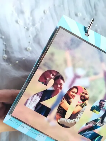 A close-up on the transparent cover of the 2022 calendar, showing the photo collage detail.