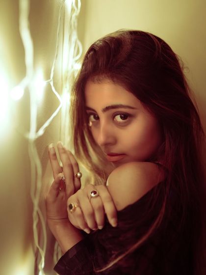 Using fairy lights is a simple way to add a magical, dreamy quality to an indoor portrait. The warm glow is soft and flattering.