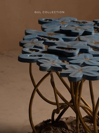 The elegant curves of the brass stems in the Gul Collection table create a sense of movement, as if the flowers are growing right out of the concrete base. It's a perfect blend of natural inspiration and artistic craftsmanship.