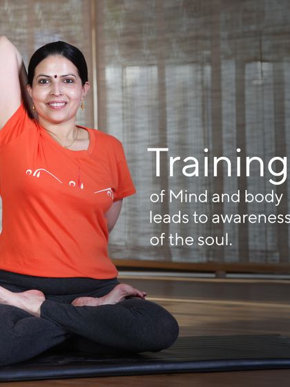 "Training of mind and body leads to awareness of the soul." This image of me in Gomukhasana (Cow Face Pose) embodies this principle. The physical practice is a gateway to deeper self discovery and spiritual connection.