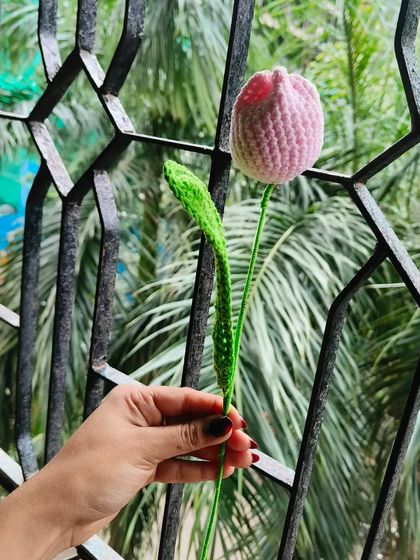 This single pink crochet tulip is so delicate and pretty. It's handcrafted with care to bring timeless beauty and warmth to any space.