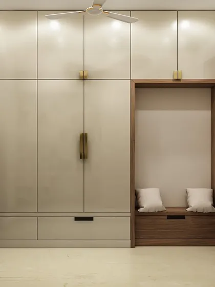 Another versatile storage solution, this wardrobe unit includes a cozy seating nook with built-in shoe storage. The combination of off-white and wood finishes adds warmth and sophistication.
