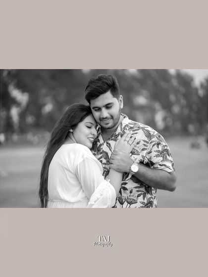 A tender black and white portrait of the couple in a gentle embrace. Monochrome photos often highlight the emotion of a moment, and this image is full of quiet affection.