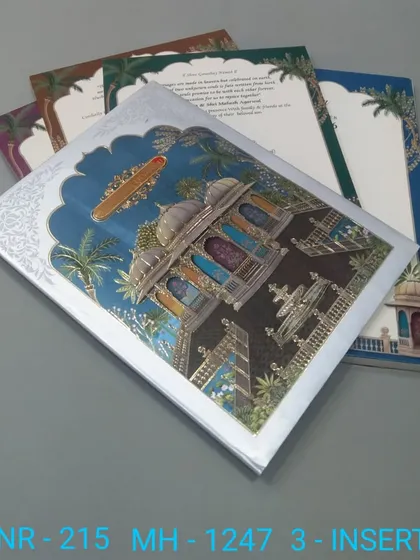 A stunning invitation with a 3D illustration of a palace at night, available with inserts in various rich colors. The silver foil details make the design pop against the dark blue background.