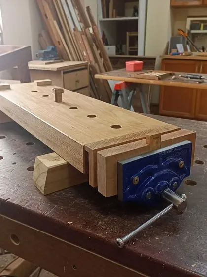 A portable workbench made by a student from a single, solid plank of beechwood. It's a fantastic project that gives you a sturdy work surface you can take anywhere.