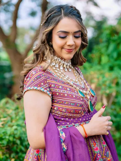 A serene and happy bride. The soft makeup and beautiful colors of her outfit make her look absolutely radiant.