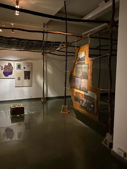 Another angle of the immersive installation, showing the interplay of different textile works.