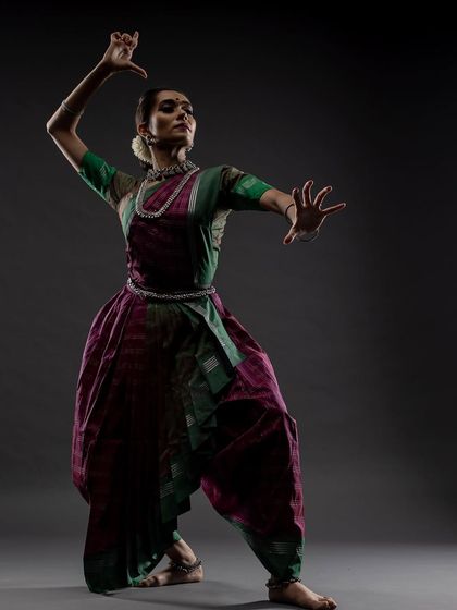 A powerful, high-contrast image representing Chandraghanta, the third form of Durga. The lighting emphasizes the fierce yet graceful nature of the deity.