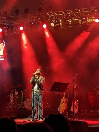 Singing under the red lights in Mumbai. The lighting plays a huge role in setting the mood for each song during our live set.