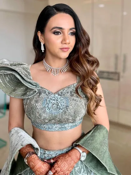 Another angle of this glamorous look, showing how the makeup and hair work together. The Hollywood waves and smokey eye are a classic combination for a reason.