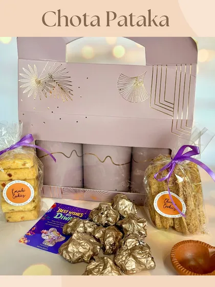 The 'Chota Pataka' Diwali hamper, beautifully packaged and filled with assorted chocolates, churro cookies, Karachi cookies, and a diya. It's a perfect small gift bursting with flavor.