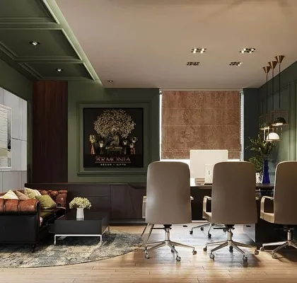 Another perspective of the olive green office, showing the layout from the executive desk. The space is designed to be cohesive, with the seating area and workstation flowing together seamlessly within the richly decorated room.
