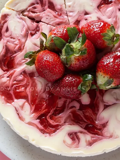 Wintertime calls for some Baked Strawberry Cheesecake. A creamy egg-free cheesecake swirled with my house-made fresh strawberry compote, topped with whole strawberries.