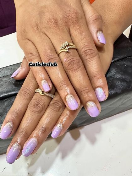 A beautiful lavender ombre with a sprinkle of glitter at the cuticles. This is a soft, shimmery look that's perfect for spring.